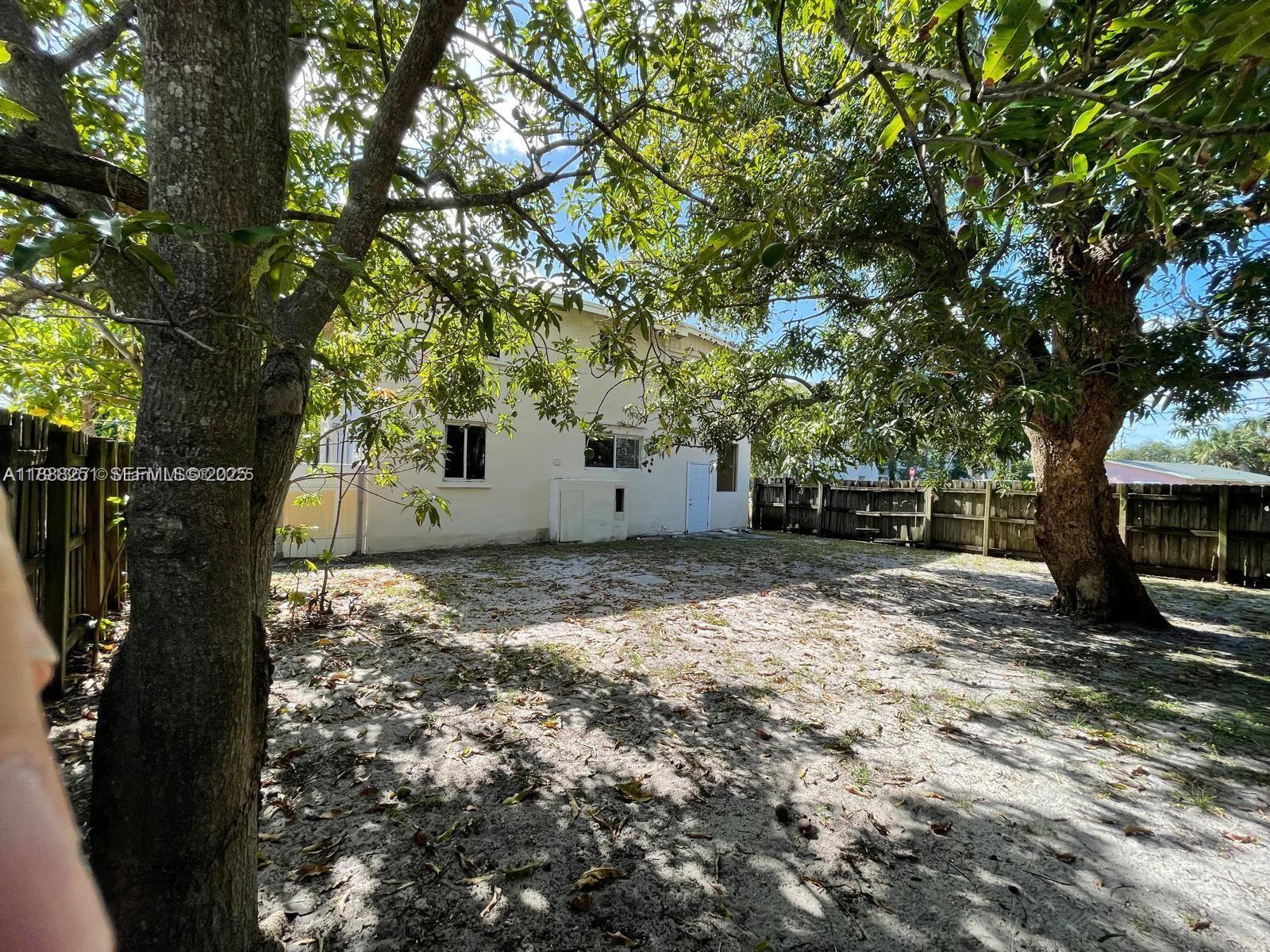 3 Southwest 7th Avenue Dania Beach, FL 33004 - Photo 3 of 25 a view of a backyard with large trees