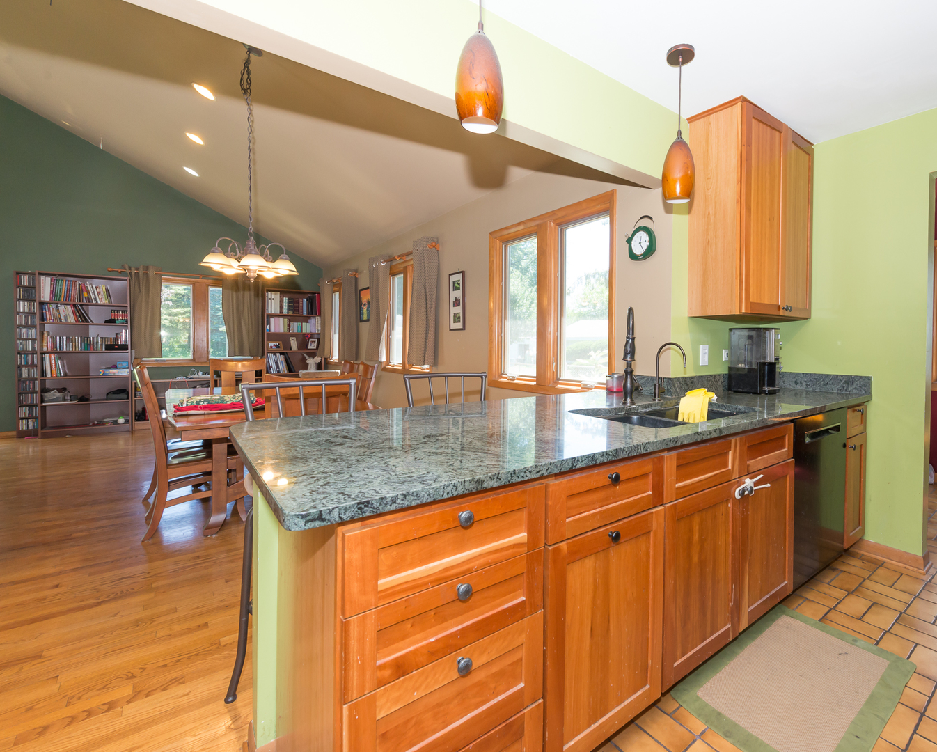 1S183 Valley Road Lombard, IL 60148 - Photo 3 of 25 a kitchen with stainless steel appliances granite countertop a sink dishwasher stove and cabinets with wooden floor