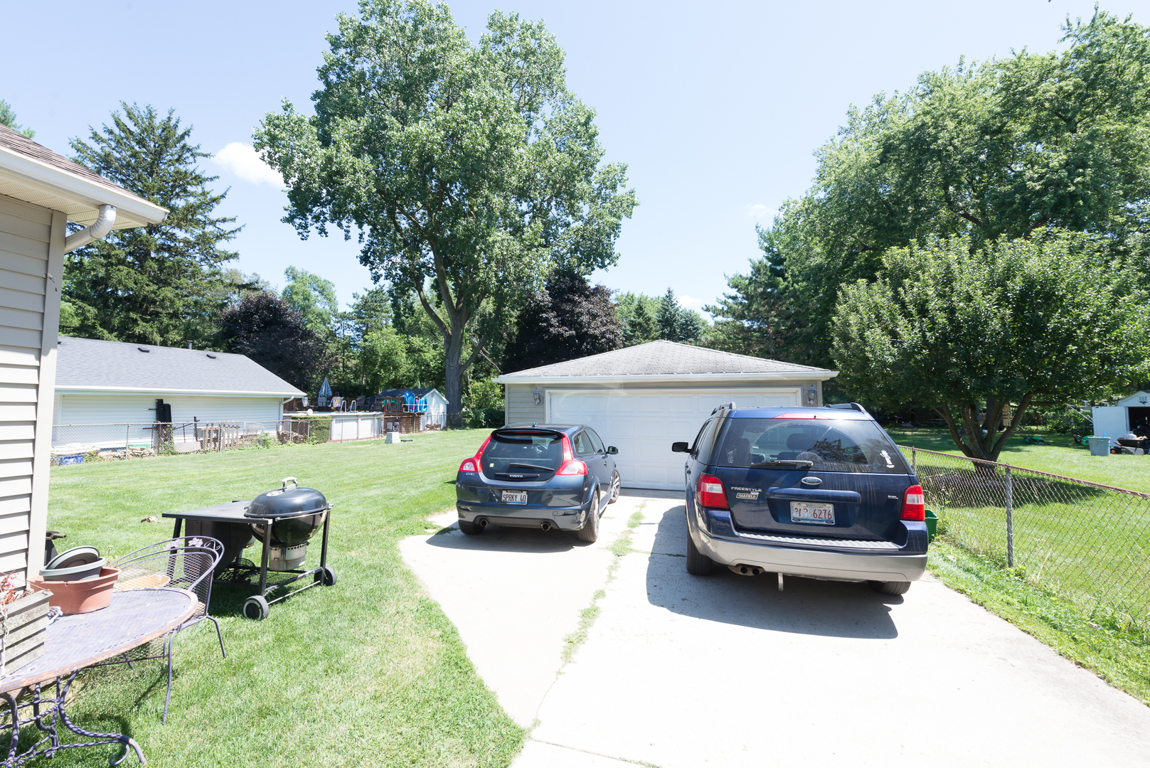 1S183 Valley Road Lombard, IL 60148 - Photo 22 of 25 a car parked in front of a house with a yard