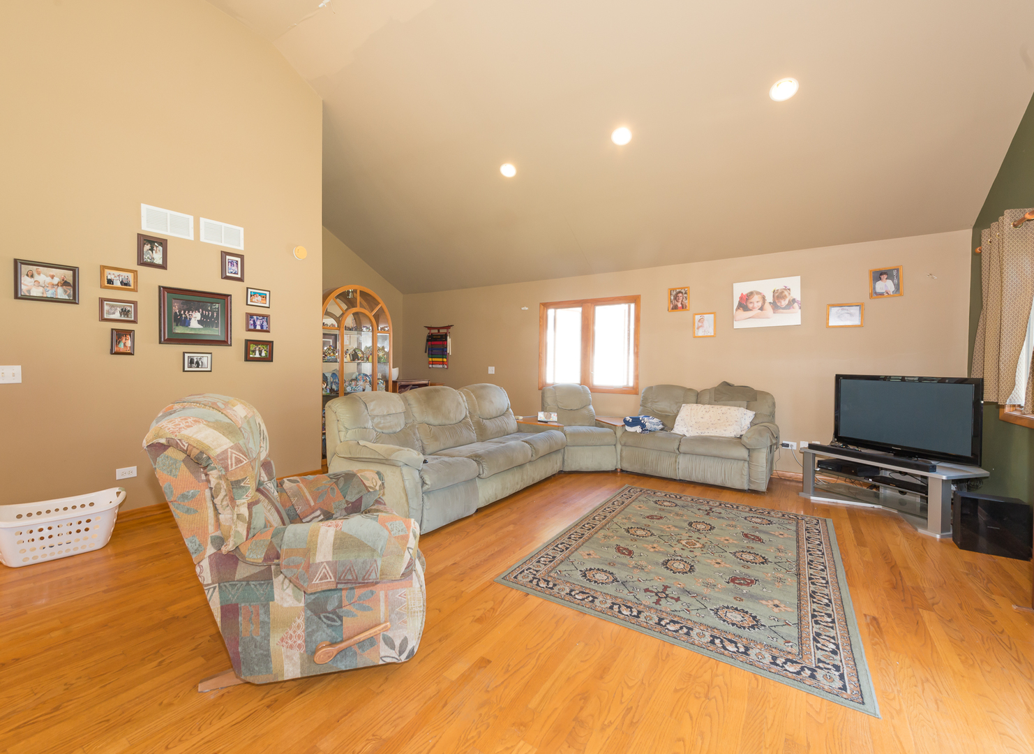 1S183 Valley Road Lombard, IL 60148 - Photo 8 of 25 a living room with furniture and a flat screen tv