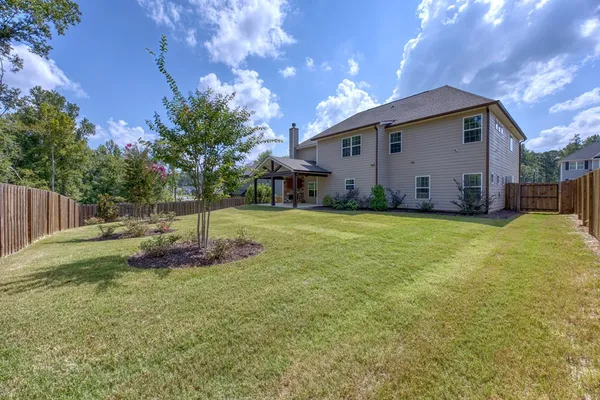aerial view of a house with a yard