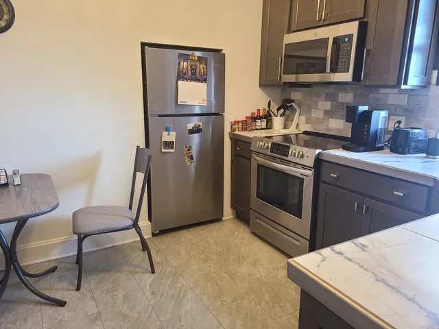 a kitchen with a sink cabinets and appliances