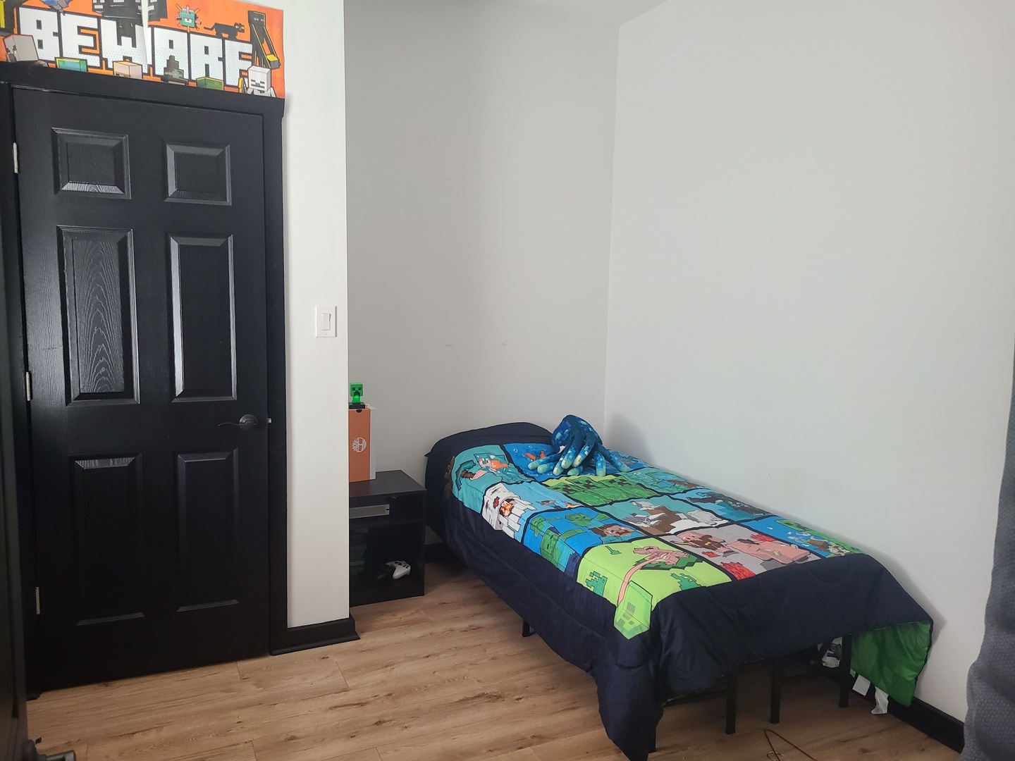 1818 4th Street Peru, IL 61354 - Photo 25 of 36 a bed sitting in a bedroom with a baby crib