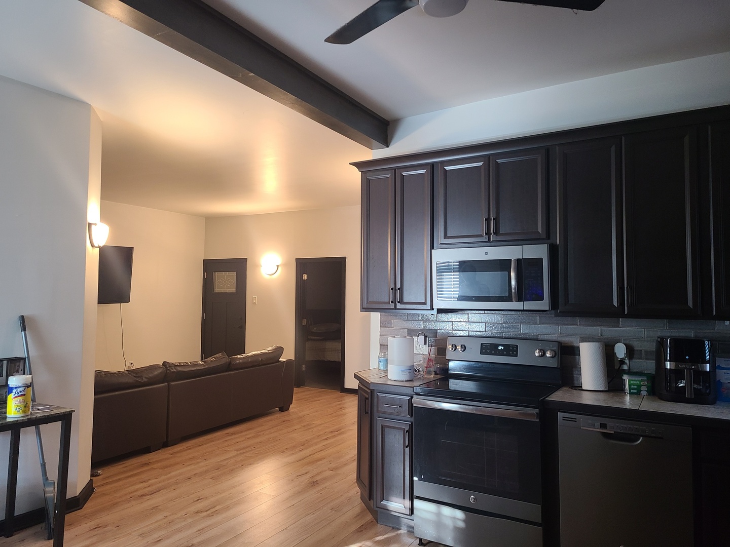1818 4th Street Peru, IL 61354 - Photo 3 of 36 a kitchen with stainless steel appliances wooden cabinets granite counter tops and wooden floors