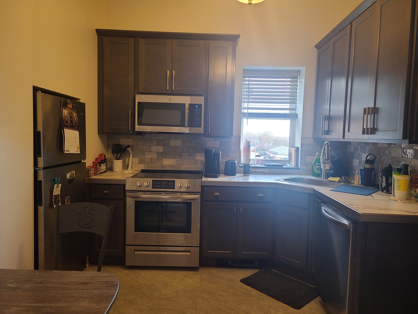 1818 4th Street Peru, IL 61354 - Photo 5 of 36 a kitchen with a stove microwave and sink