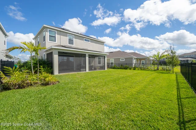 a view of a swimming pool with an outdoor seating