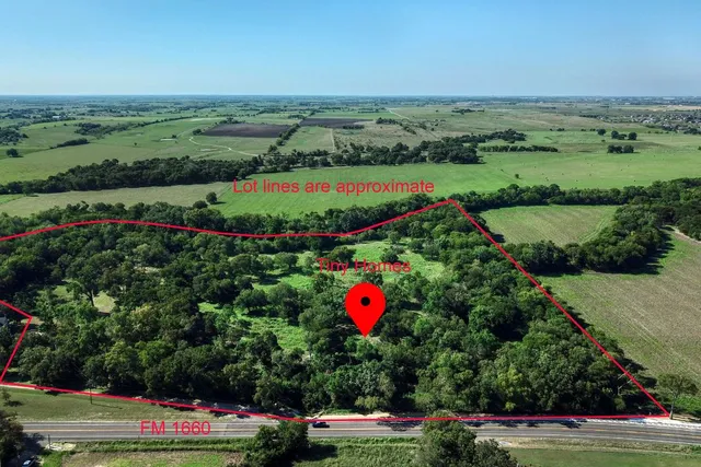an aerial view of lake with residential houses