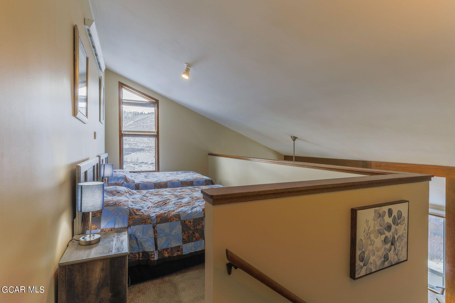 96 Mountainside Drive, Unit B 58 Granby, CO 80446 - Photo 11 of 42 a bedroom with a bed and a window