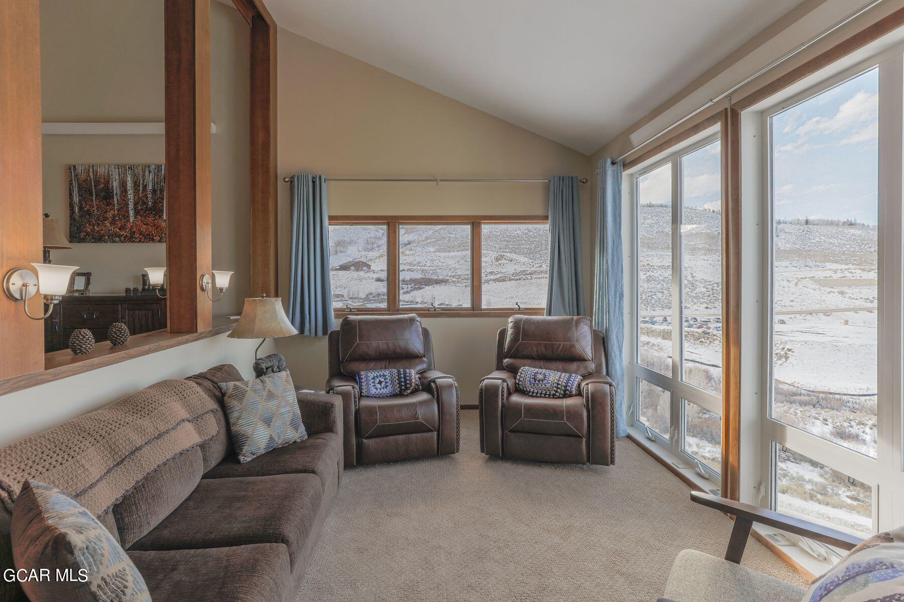 96 Mountainside Drive, Unit B 58 Granby, CO 80446 - Photo 13 of 42 a living room with furniture and a large window