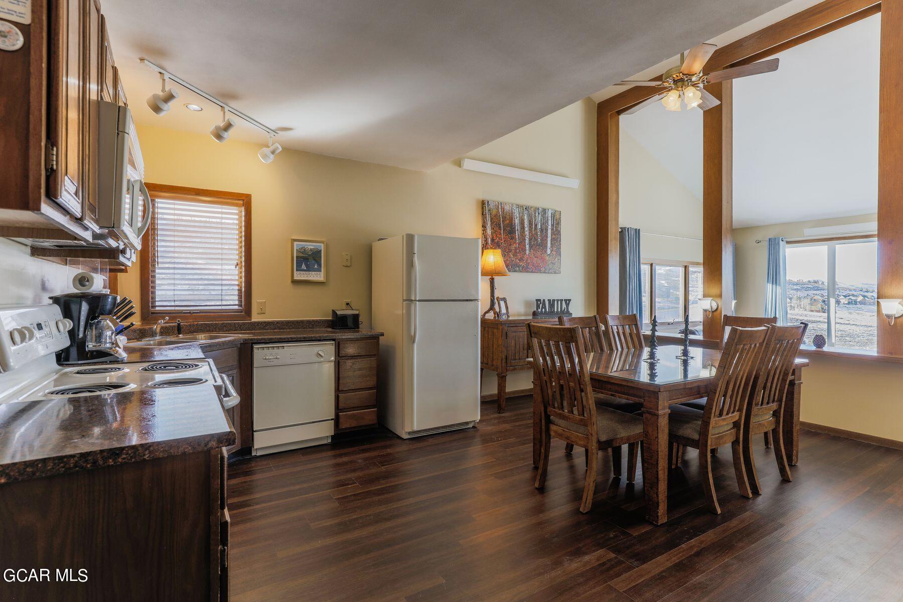 96 Mountainside Drive, Unit B 58 Granby, CO 80446 - Photo 15 of 42 a view of a dining room with furniture window and wooden floor