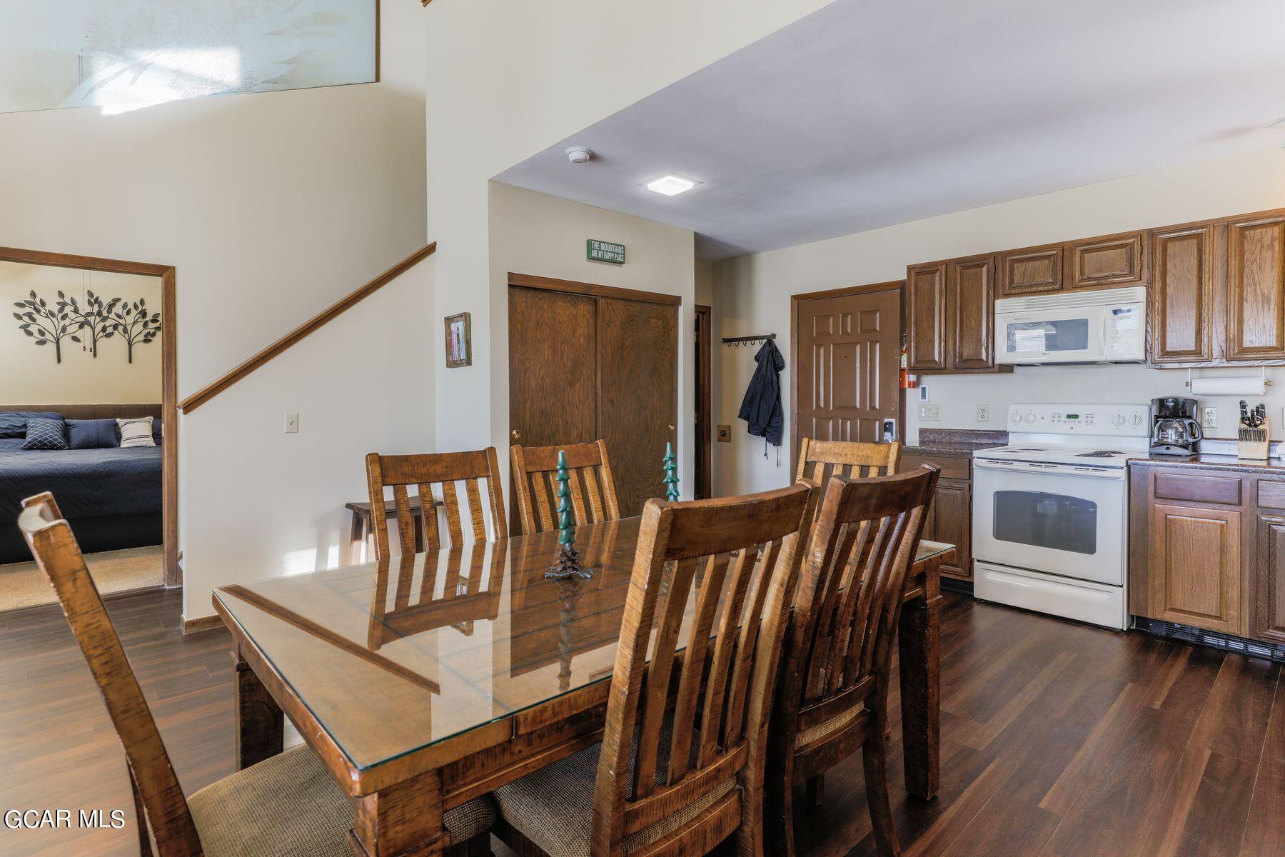 96 Mountainside Drive, Unit B 58 Granby, CO 80446 - Photo 17 of 42 a view of a dining room with furniture and wooden floor