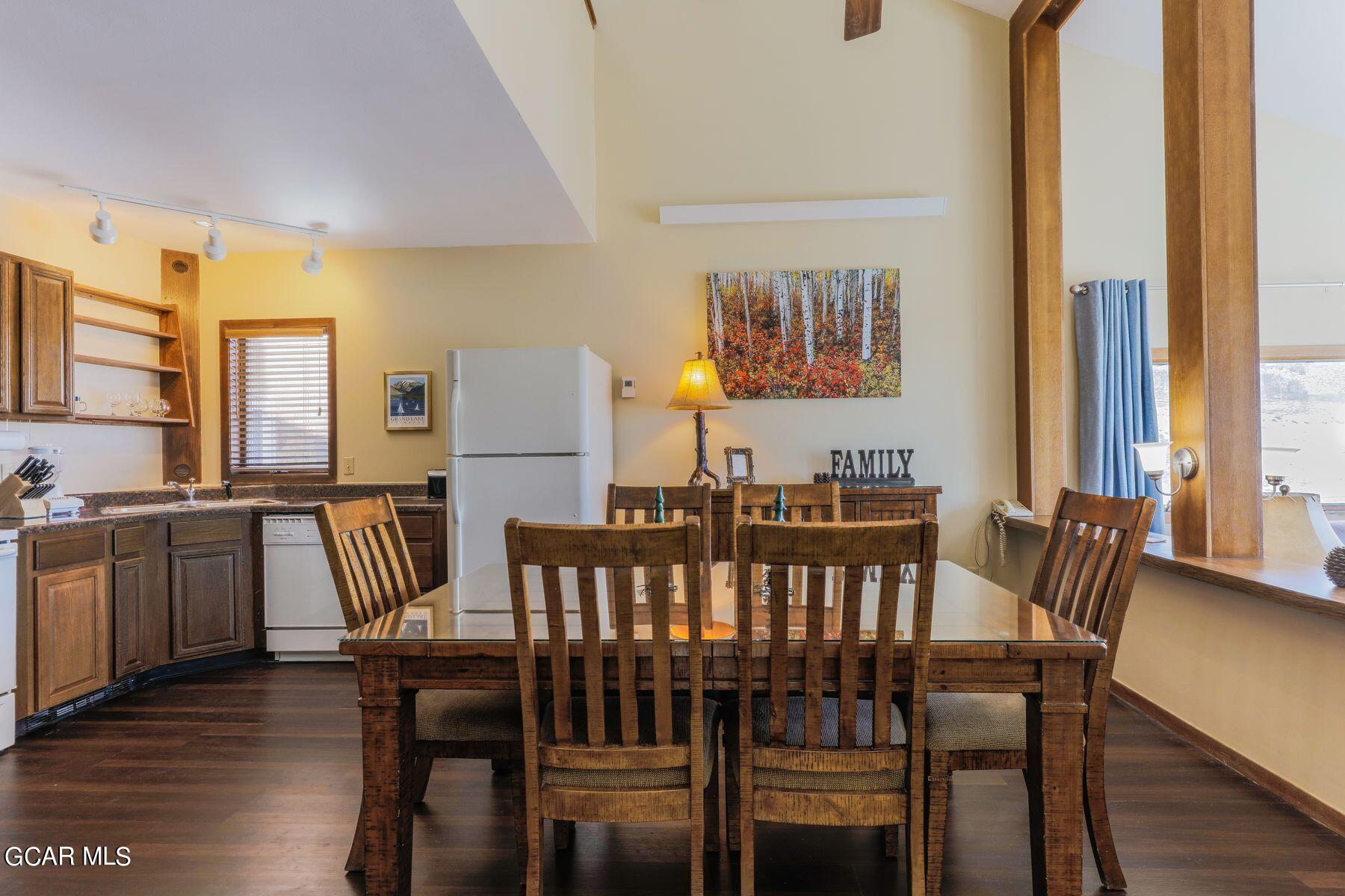 96 Mountainside Drive, Unit B 58 Granby, CO 80446 - Photo 19 of 42 a view of a dining room with furniture and a large window