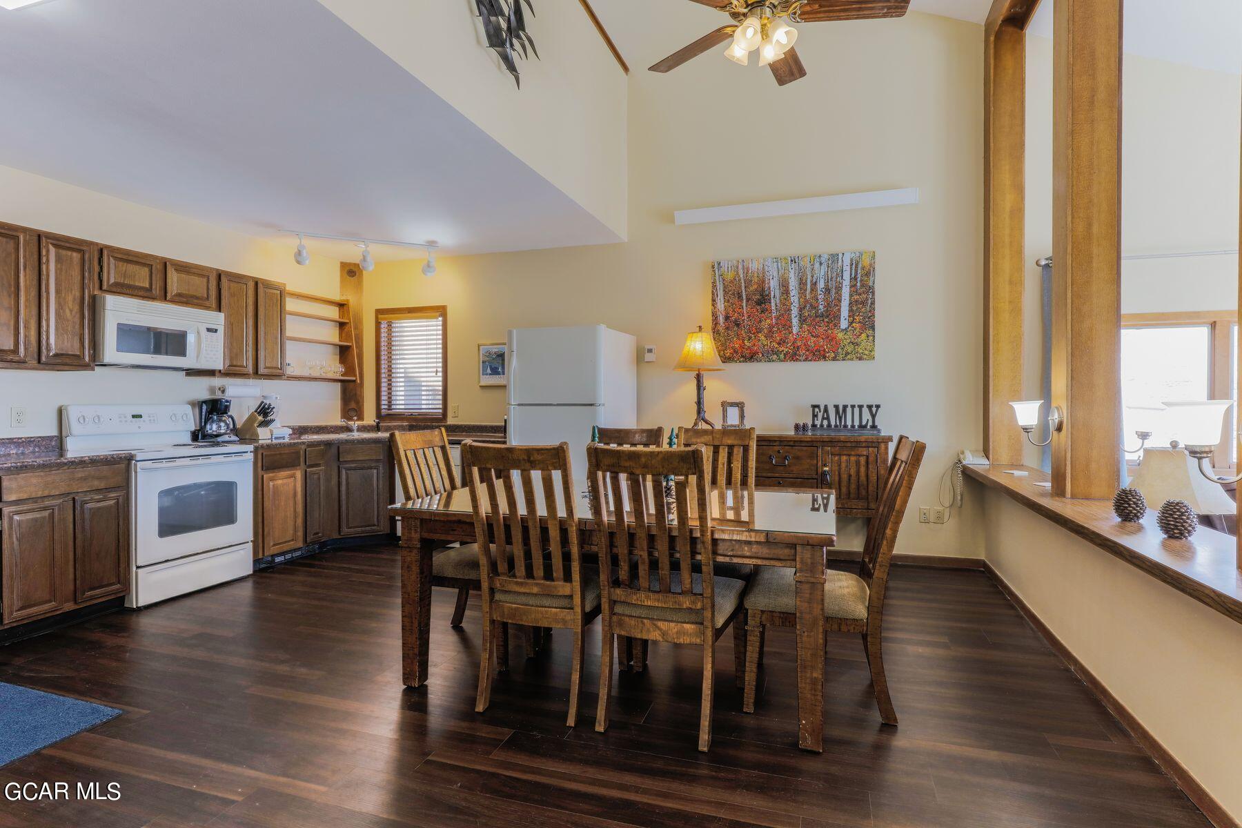 96 Mountainside Drive, Unit B 58 Granby, CO 80446 - Photo 20 of 42 a view of a dining room with furniture window and wooden floor