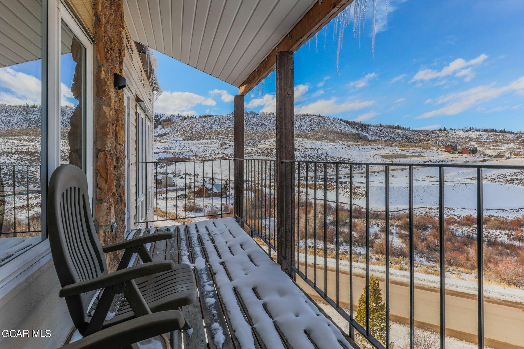 96 Mountainside Drive, Unit B 58 Granby, CO 80446 - Photo 32 of 42 a view of a balcony with wooden floor