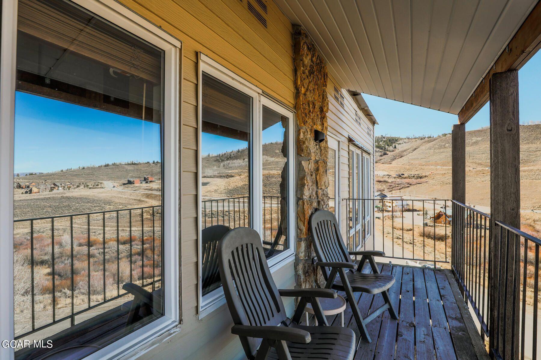 96 Mountainside Drive, Unit B 58 Granby, CO 80446 - Photo 38 of 42 a view of a city from a balcony with furniture