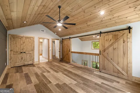 a view of a livingroom with a ceiling fan and window