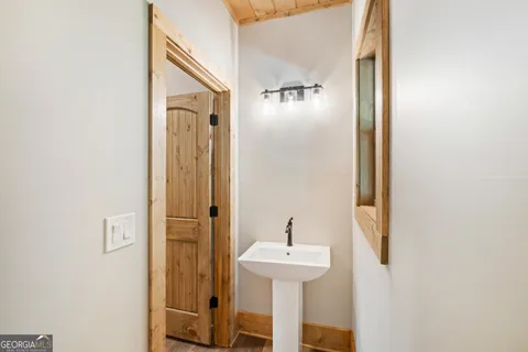 a bathroom with a sink and mirror