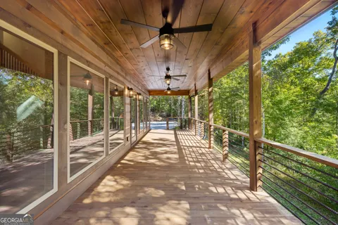 a view of a porch with wooden floor and outdoor space