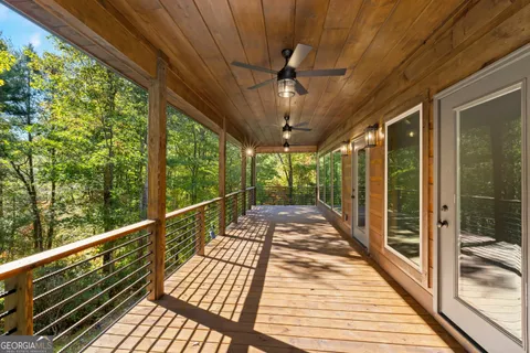 a view of balcony with wooden floor