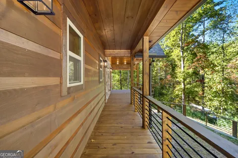 a view of a balcony with wooden floor