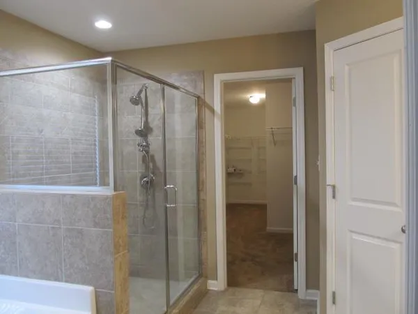 a bathroom with a bathtub and shower