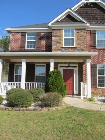 front view of a house with a yard