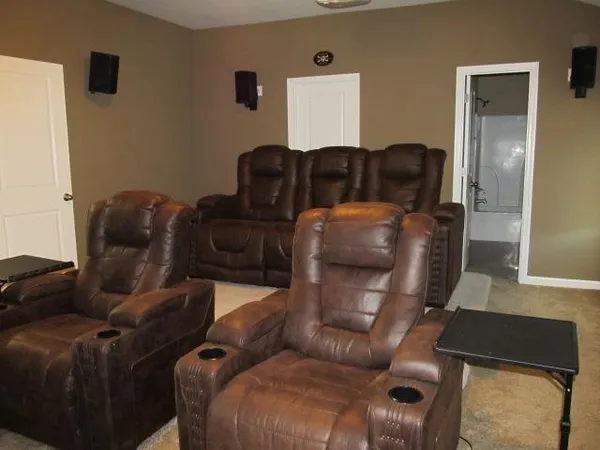 a view of a livingroom with furniture and with wooden floor