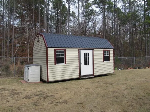 a house that has a tree in front of it