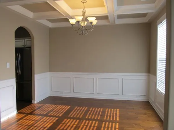a view of a livingroom with wooden floor and cabinet