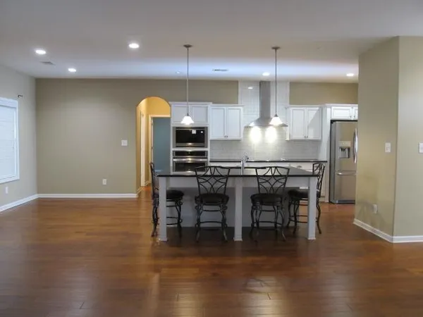 a kitchen with a table and chairs in it