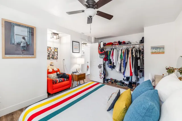 a room with toys and ceiling fan