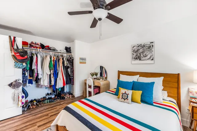 a bed room with a bed and a walk in closet