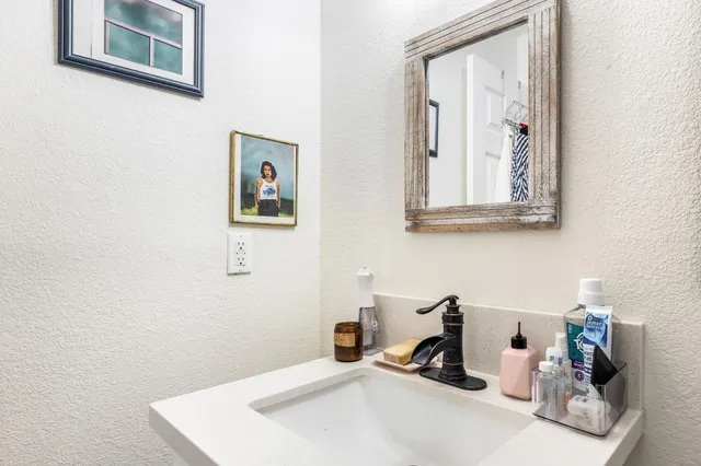 a bathroom with a sink and a mirror