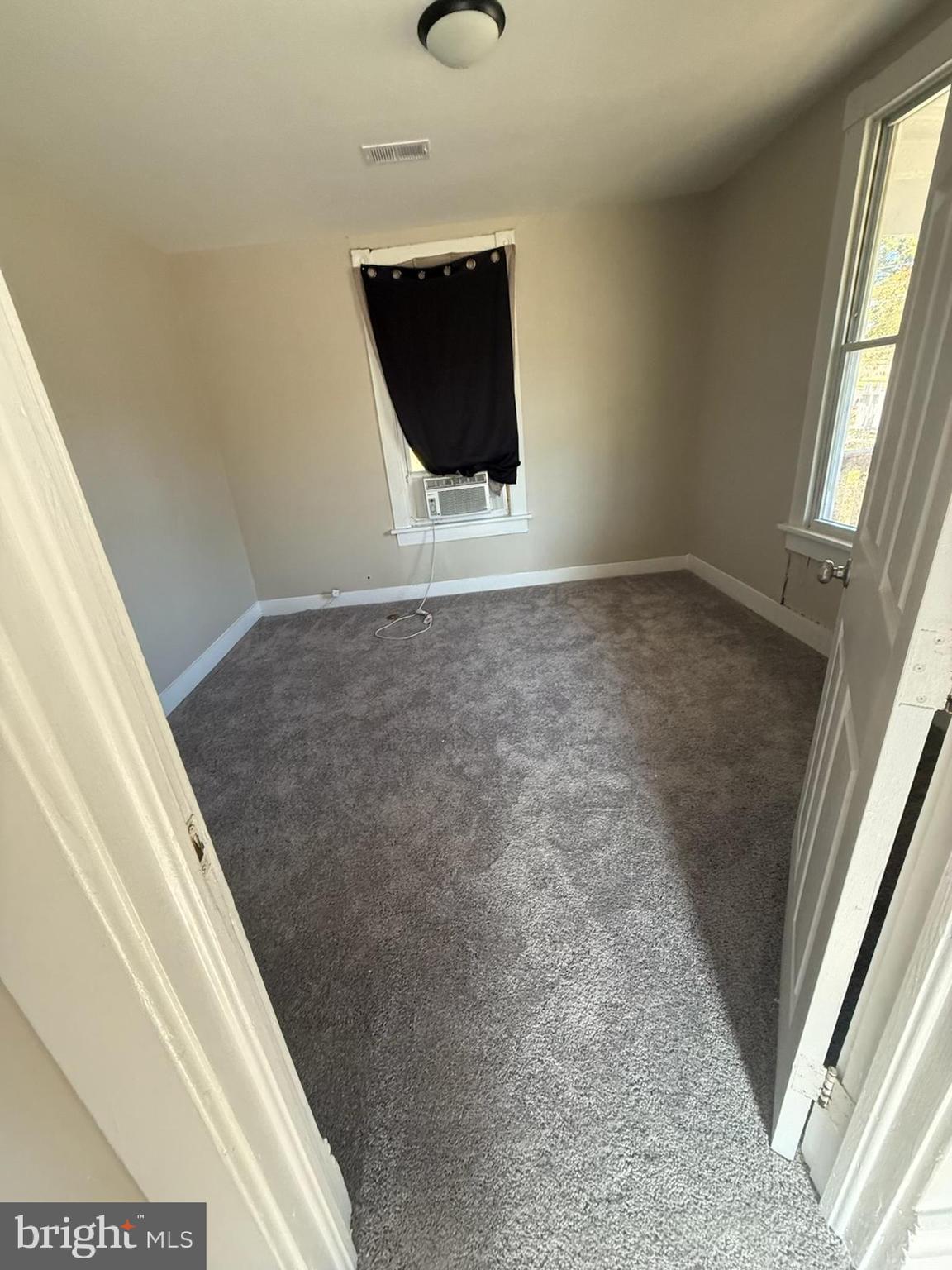 208 68th Place Capitol Heights, MD 20743 - Photo 11 of 15 a view of a room with wooden floor and windows