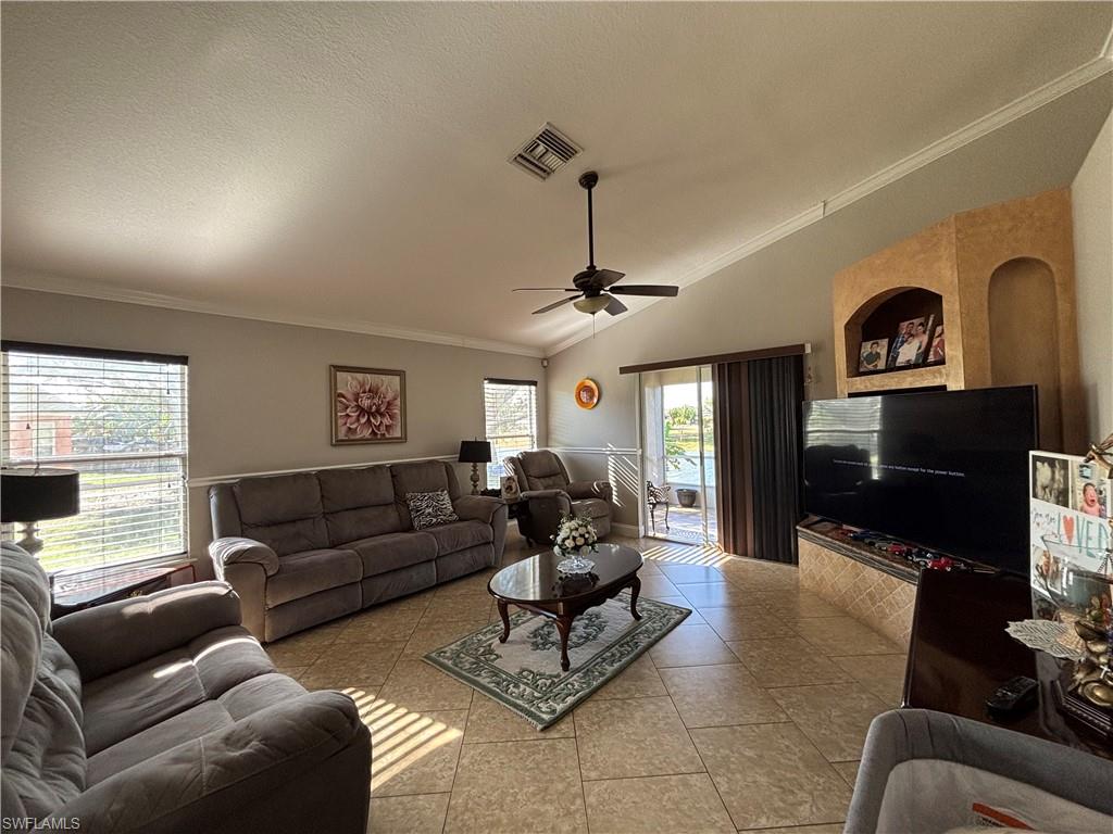 1243 Madison Court Immokalee, FL 34142 - Photo 11 of 32 a living room with furniture and a flat screen tv