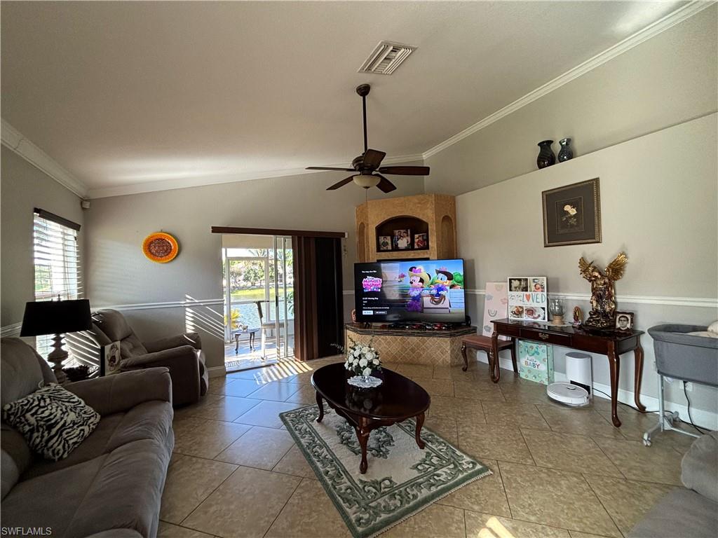 1243 Madison Court Immokalee, FL 34142 - Photo 12 of 32 a living room with furniture and a flat screen tv