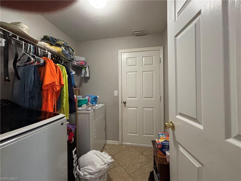 1243 Madison Court Immokalee, FL 34142 - Photo 22 of 32 a room with storage and utility