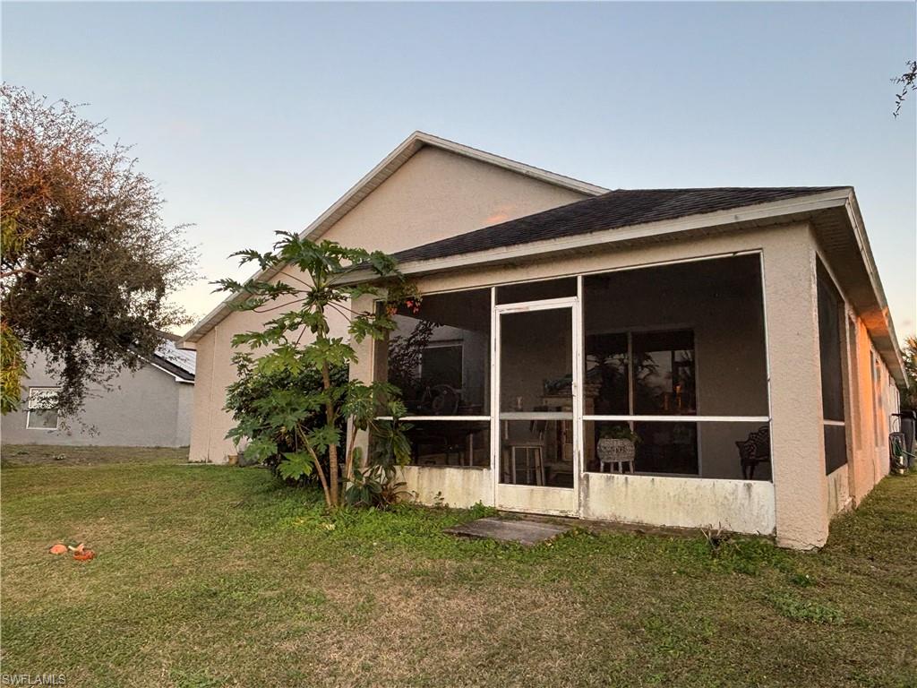 1243 Madison Court Immokalee, FL 34142 - Photo 26 of 32 a view of front a house with a large window