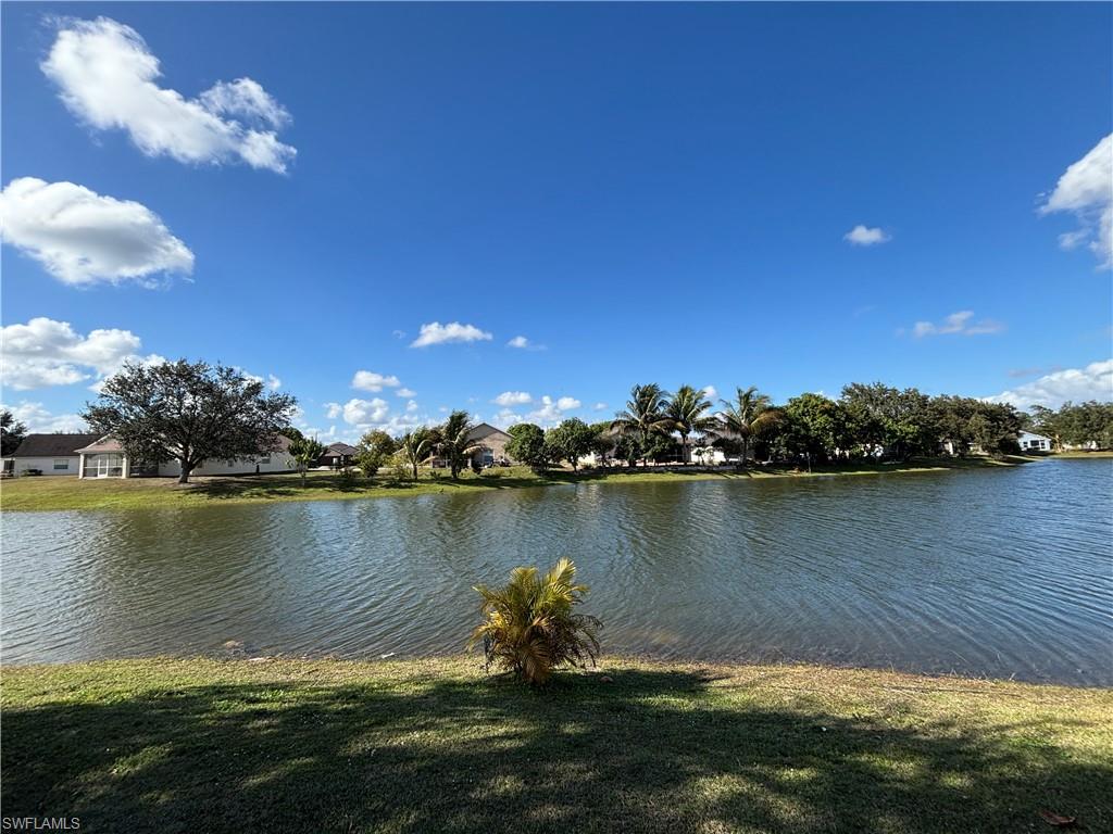 1243 Madison Court Immokalee, FL 34142 - Photo 28 of 32 a lake view with a lake view