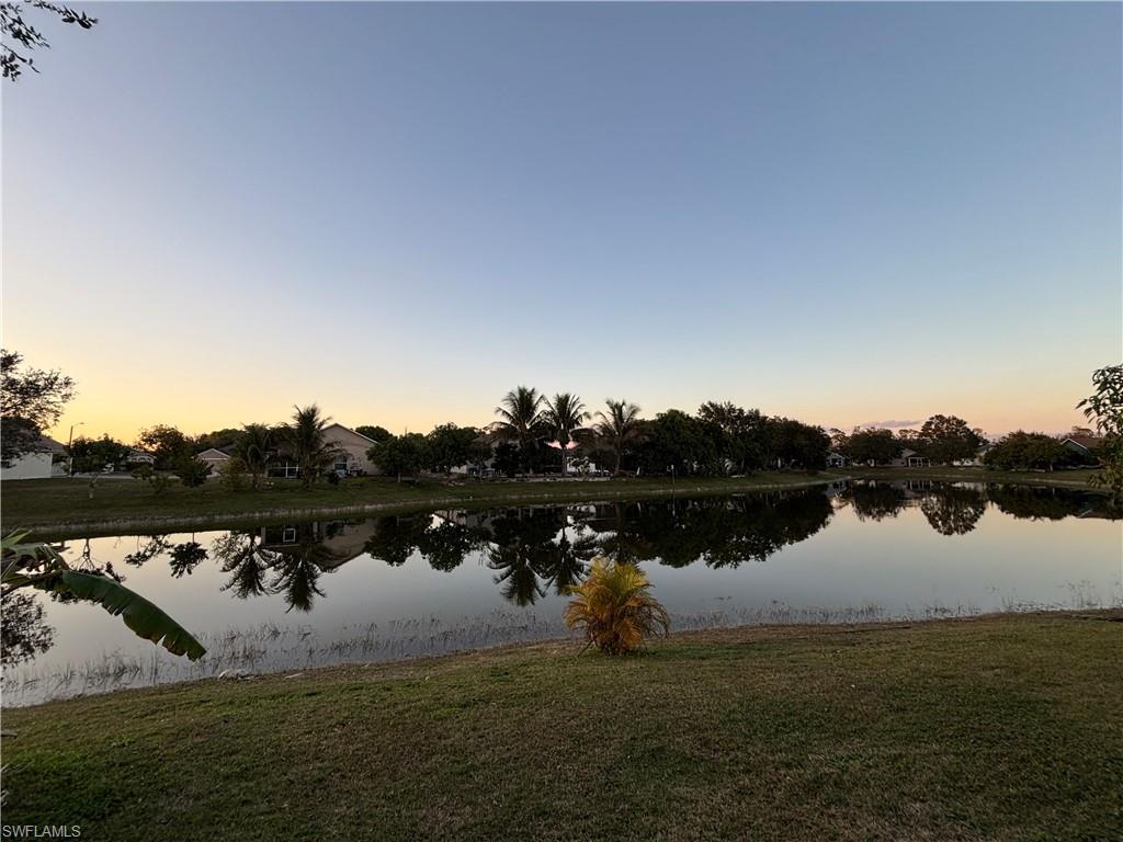 1243 Madison Court Immokalee, FL 34142 - Photo 32 of 32 a view of lake with houses