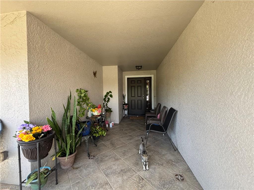 1243 Madison Court Immokalee, FL 34142 - Photo 8 of 32 a view of outdoor space and porch