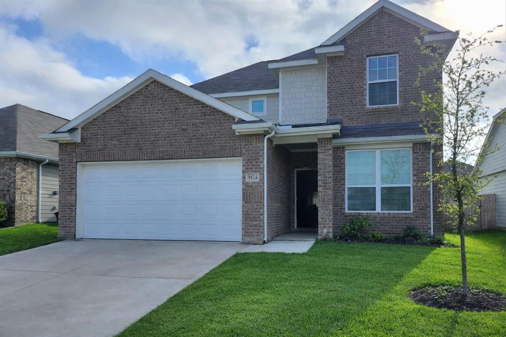 9824 Dynamic Drive Fort Worth, TX 76131 - Photo 16 of 17 a front view of a house with a garden and plants