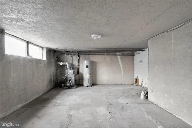 a front view of a building with parking space