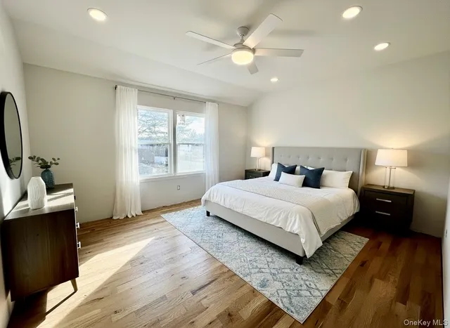 a view of a yard with a house and a large tree