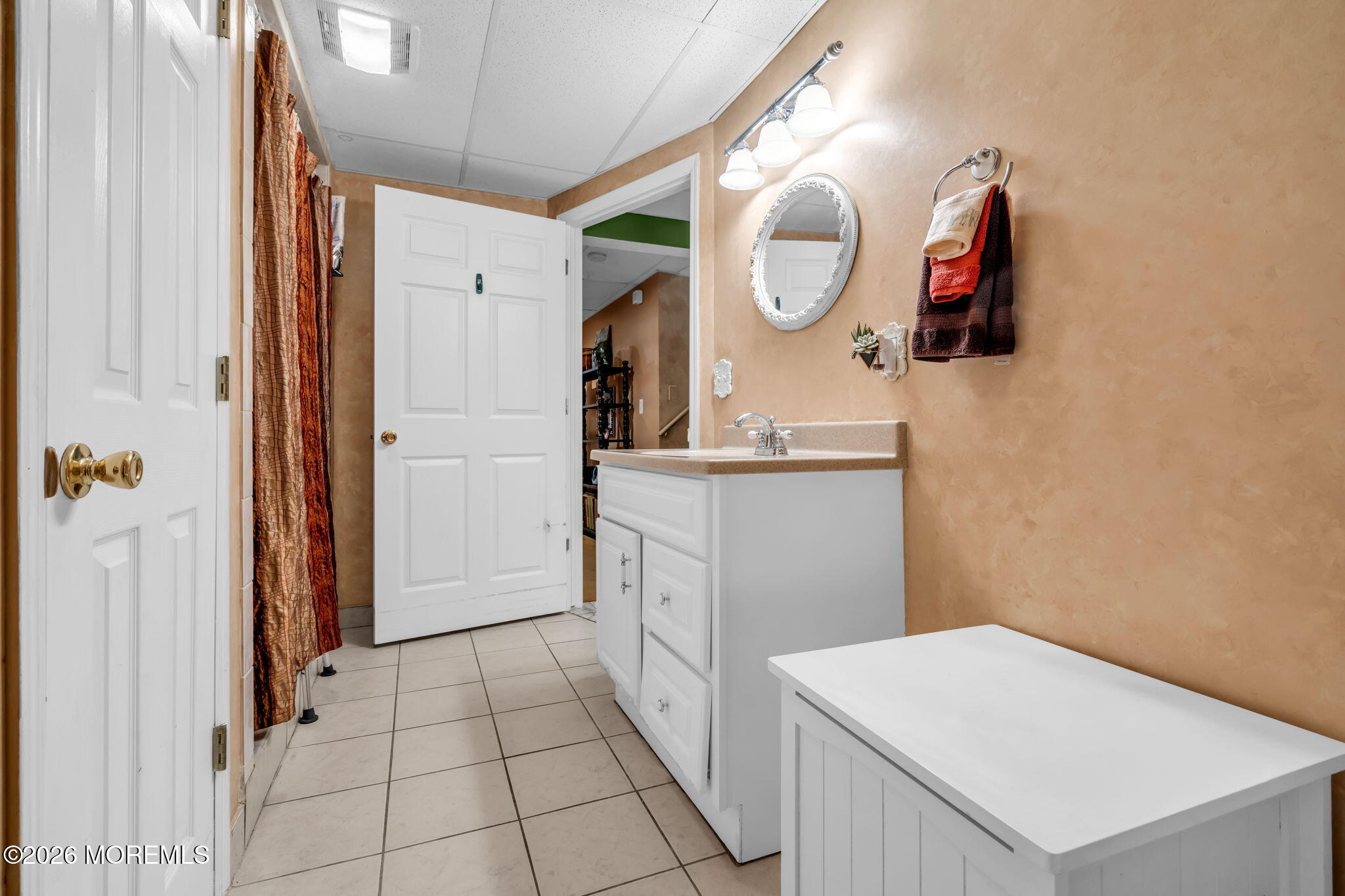 21 Ryan Road Marlboro, NJ 07746 - Photo 34 of 56 a bathroom with a sink vanity and a mirror