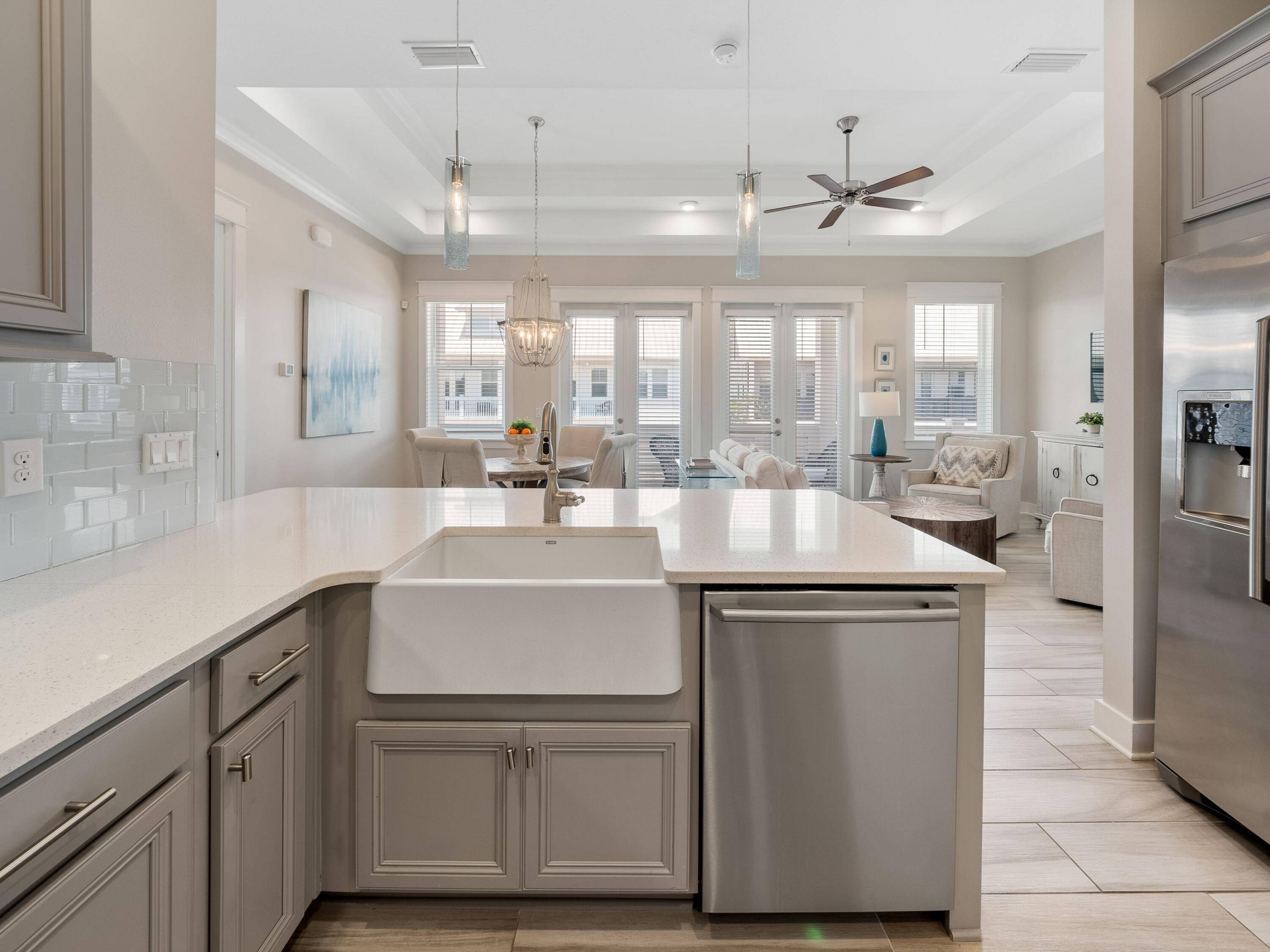 282 Milestone Dr Inlet Beach, Unit C Inlet Beach, FL 32461 - Photo 30 of 50 a kitchen with stainless steel appliances granite countertop a sink and cabinets