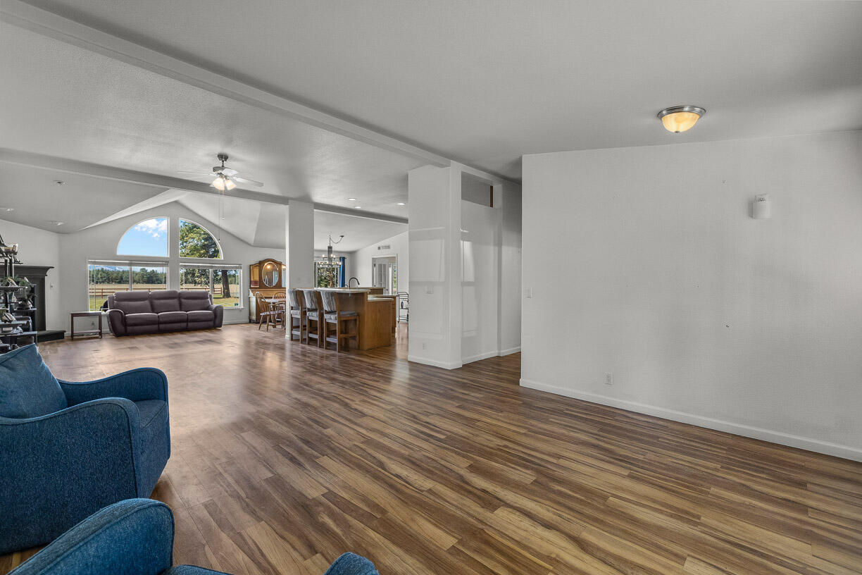 67500 Harrington Loop Road Bend, OR 97703 - Photo 10 of 72 a living room with furniture and a fireplace