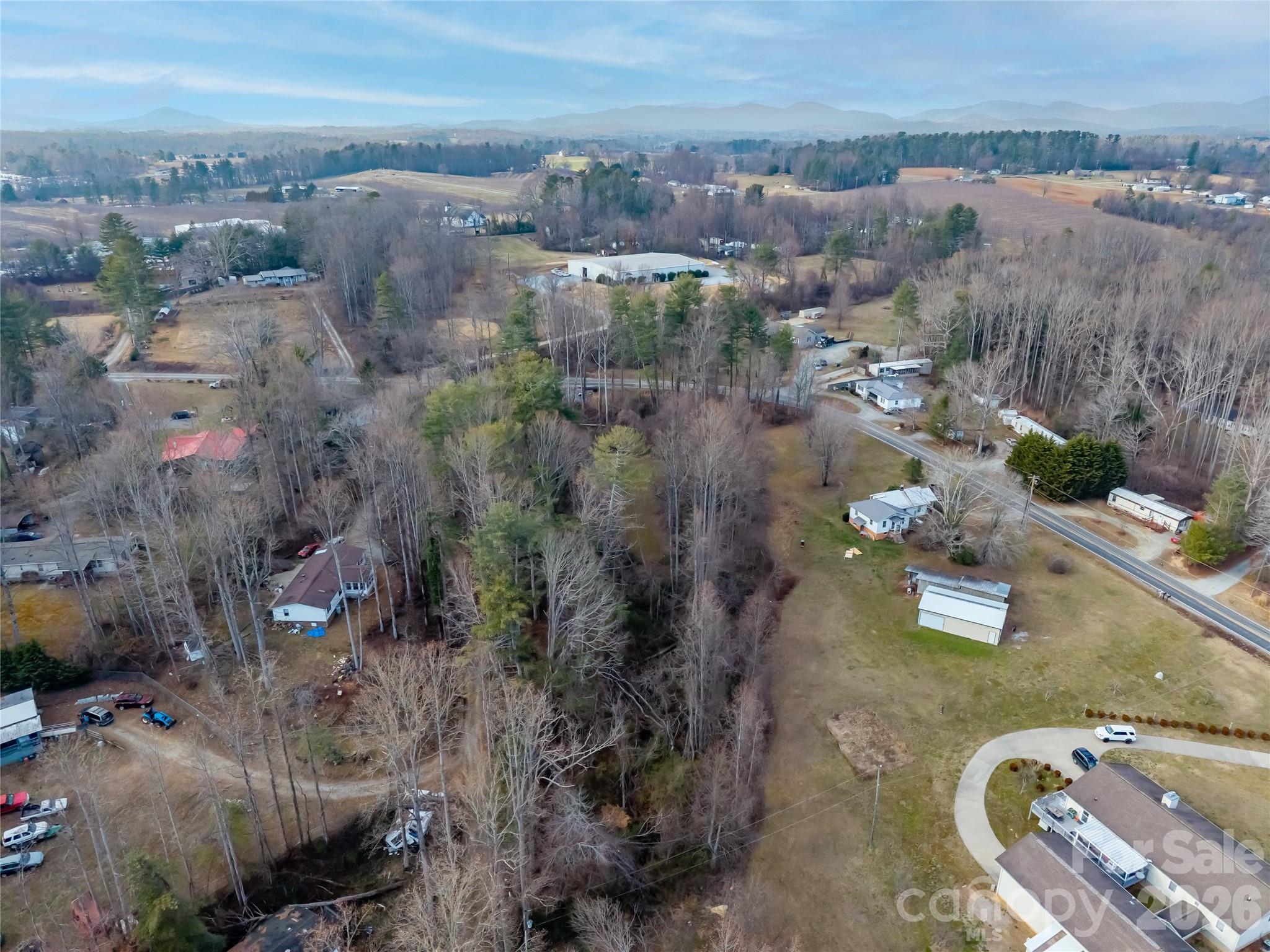 0 Jackson Loop Road, Unit 3 Flat Rock, NC 28731 - Photo 9 of 12 an aerial view of a house with a yard