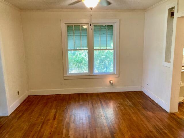 17 Nowling Drive DeFuniak Springs, FL 32433 - Photo 16 of 52 an empty room with wooden floor and windows