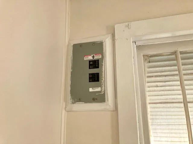 a bathroom with a shower and a door